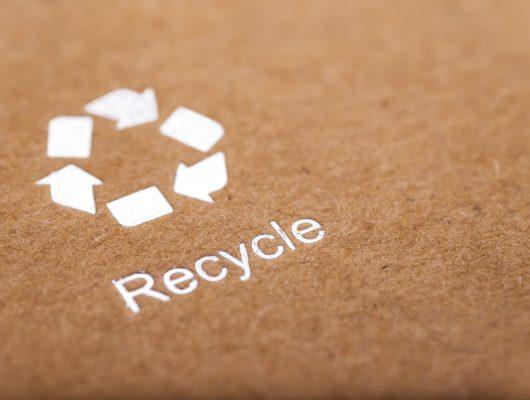 recycle symbol on cardboard box