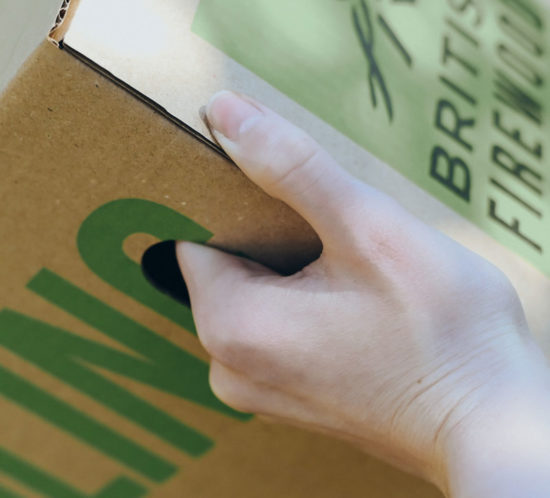 hand-holding-green-printed-packaging