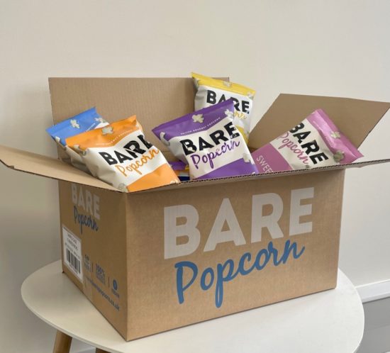 Cardboard box filled with snack packets