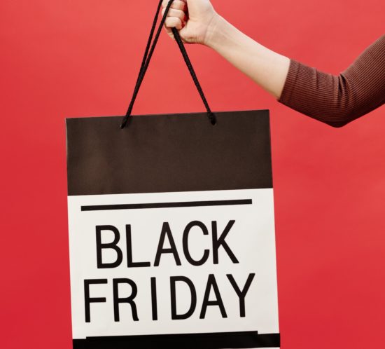 Bag-with-Black-Friday-text-being-held-in-the-air