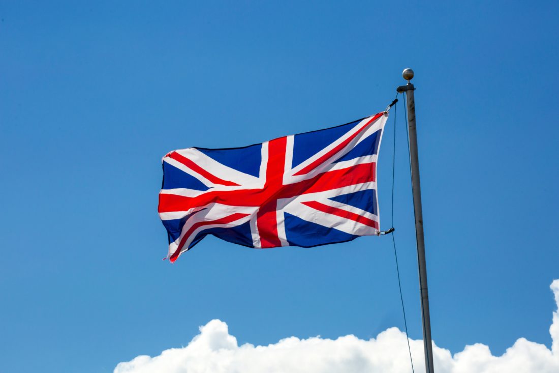 Union-Jack-flag-flying-against-blue-sky