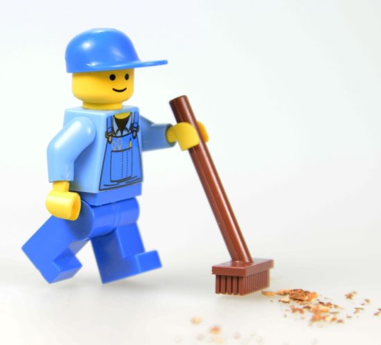 Lego-figure-sweeping-floor