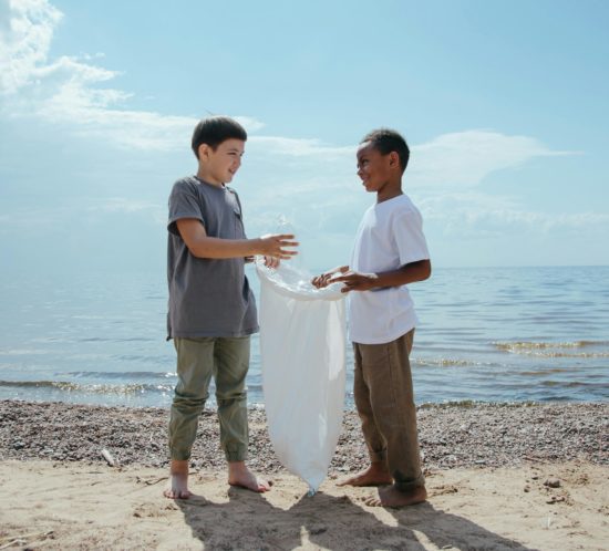 Boys-collecting-plastic-packaging-on-beach
