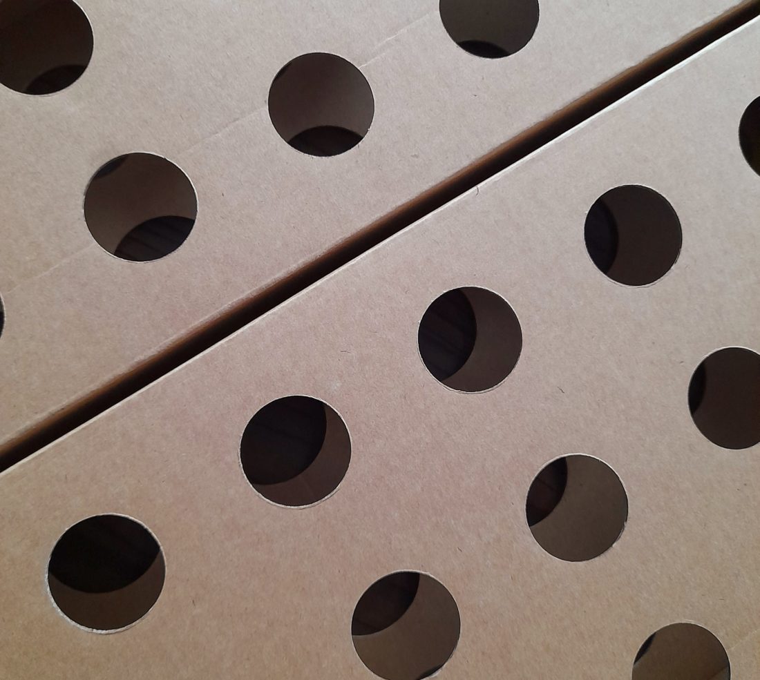 cardboard-inserts-with-die-cut-holes-to-improve-presentation-in-shelf-ready-packaging