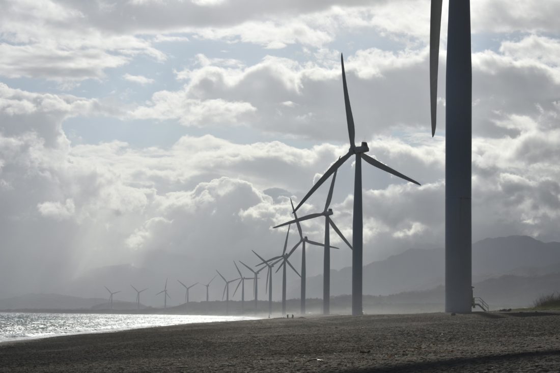 wind-turbines-against-a-cloudy-sky-produce-renewable-energy-carbon-offset