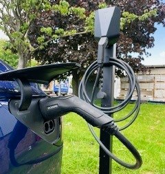 Car-plugged-into-an-electric-vehicle-charger