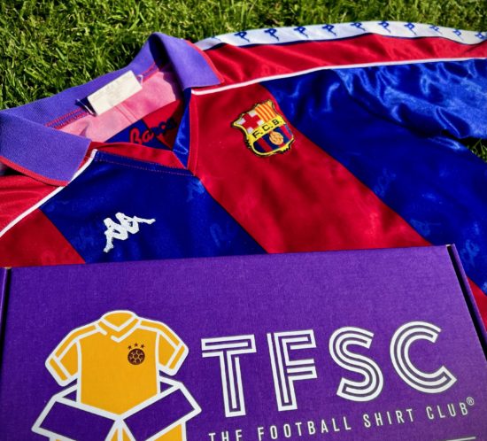 football-shirt-and-printed-box-on-grass