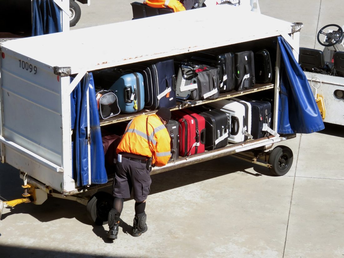 baggage-handler-with-case-in-containers