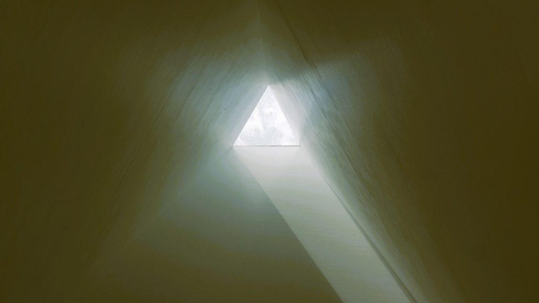 looking-inside-triangular-tube-with-light-at-end