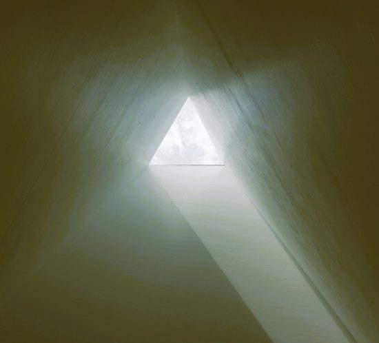 looking-inside-triangular-tube-with-light-at-end