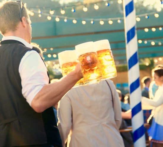 man-carrying-beer-at-Oktoberfest