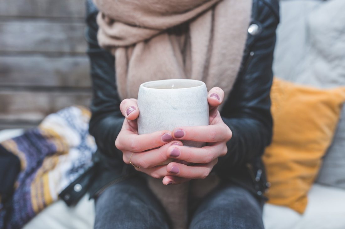 hands-around-a-mug-of-hot-drink