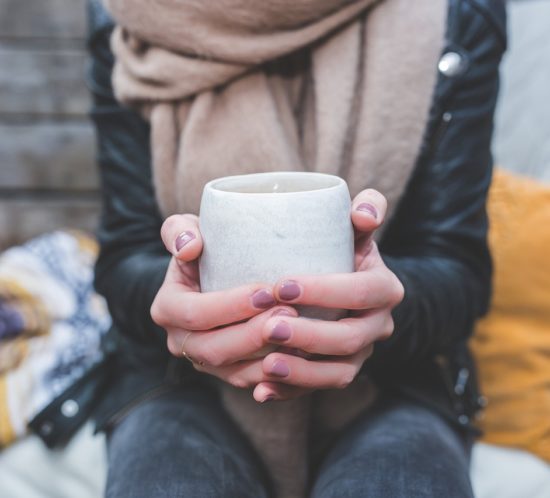 hands-around-a-mug-of-hot-drink