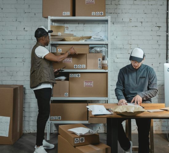 two men sorting deliveries and ecommerce returns